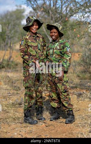 Two women from the anti-poacher unit Black Mambas with confiscated poacher snares, Balule Game Reserve, Limpopo Province, South Africa Stock Photo