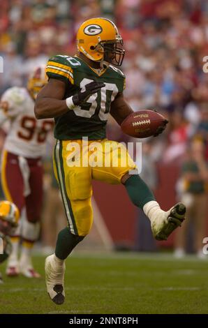 Running back Ahman Green of the Green Bay Packers is tackled by the  Washington Redskins defensive back Todd Franz. The Packers defeated the Redskins  28-14 on Sunday October 31, 2004 at Fed