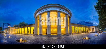 Fountains in front illuminated building, Elisenbrunnen, Aachen, North Rhine Westphalia, Germany Stock Photo