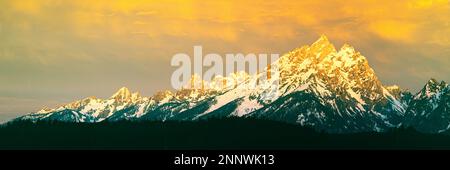 Snowcapped mountain peak at sunset, Grand Teton National Park, Wyoming, USA Stock Photo