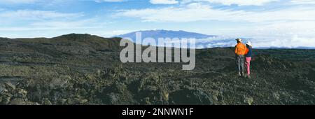 Hikers at Kilauea Crater and Mauna Loa, Hawaii Volcanoes National Park, Hawaii Islands, USA Stock Photo