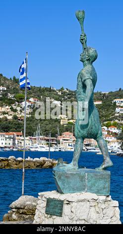 Statue of Georgios Anemogiannis and Greek flag, Gaios, Paxos, Ionian Islands, Greece Stock Photo