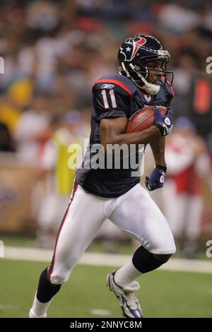 2008 August 16: Houston Texans defensive end Mario Williams looks up at the  instant replay after New Orleans Saints receiver Marques Colston scored on  a one-handed 5-yard touchdown catch in the second