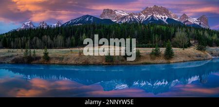 Three Sisters Mountain and Mount Lawrence Grassi at sunset, Canmore, Alberta, Canada Stock Photo
