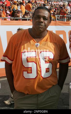 08 NOV 2009: 1979 Tampa Bay Buccaneers Reggie Lewis (79), Randy Crowder  (71) and Danny Reece (46) wearing the old jersey and relaxing on the  sidelines before the game between the Green