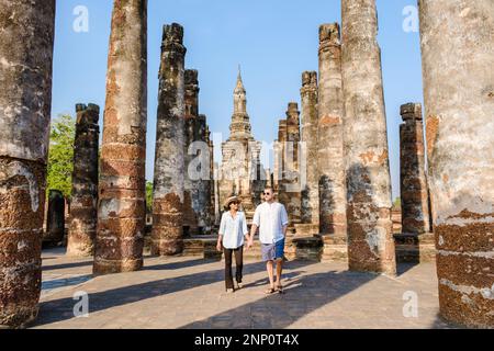 Couple visit Wat Mahathat, Sukhothai old city, Thailand., Sukothai ...