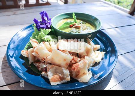 naan bread or roti with curry soup or green curry for serve Stock Photo