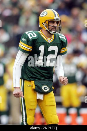 30 November 2008: Green Bay Packers quarterback Aaron Rodgers (12) hands  off the football in the first quarter at Lambeau Field in Green Bay,  Wisconsin. The Panthers defeated the Packers 35-31. (Icon