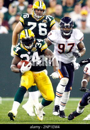 Chicago Bears Cedric Benson runs past Green Bay Packers Atari Bigby in the  second quarter at Lambeau Field on Sunday, October 7, 2007, in Green Bay,  Wisconsin. (Photo by Jim Prisching/Chicago Tribune/MCT/Sipa