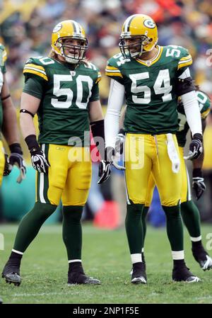 Green Bay Packers linebacker A.J. Hawk (L) and cornerback Charles