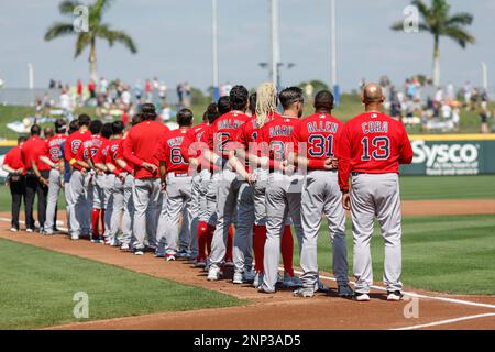 North Port FL USA: The Boston Red Sox stand at the singing of our National Anthem prior to an MLB spring training game against the Atlanta Braves at C Stock Photo