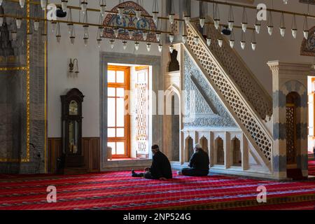 Islamic or ramadan concept photo. Muslim elder men praying in the mosque. Konya Sultan Selim Mosque. Konya Turkiye - 5.18.2022 Stock Photo