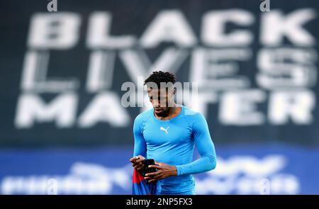 Crystal Palace's Wilfried Zaha removes his shirt as he leave the pitch  following the English Premier League soccer match between Crystal Palace  and Manchester City at Selhurst Park in London, England, Saturday