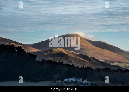 Dramatic Winter landscape image looking across countryside in Lake District with hard frost on the ground and crisp blue sky Stock Photo