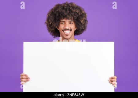 Smiley african man holding a blank panel Stock Photo