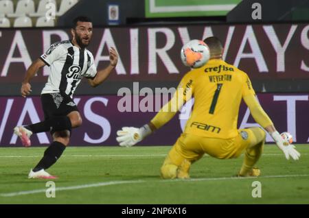 Antonio Bareiro of Paraguay s Libertad left shoots the ball in