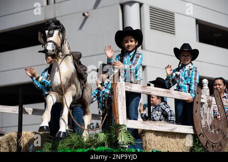 Houston, USA. 25th Feb, 2023. Young cowgirls riding a float are pictured during the 91st Downtown Rodeo Parade in Houston, Texas, the United States, Feb. 25, 2023. Credit: Chen Chen/Xinhua/Alamy Live News Stock Photo