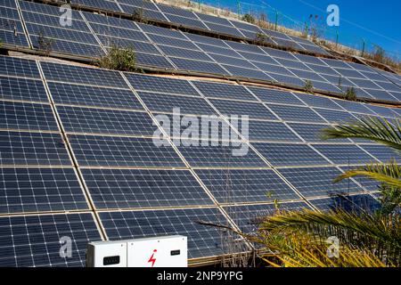 Dusty solar panels surface requires maintenance and cleaning. Solar power electric generating system and facility Stock Photo