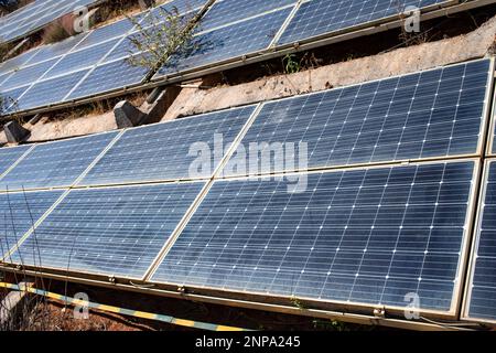 Dusty solar panels surface requires maintenance and cleaning. Solar power electric generating system and facility Stock Photo