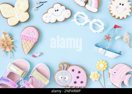 Bright creative layout made of cute summer symbols with copy space on blue background. Top view, Flat lay. Creative summer concept. Stock Photo