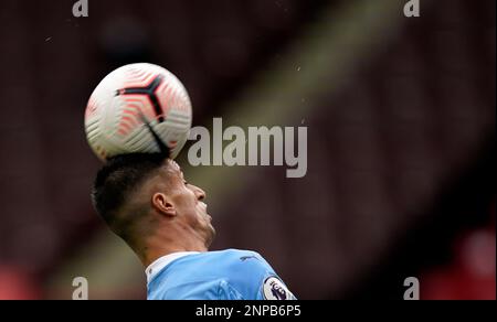 Manchester City's Joao Cancelo heads the ball during the Champions