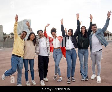 Group of multi-ethnic teenagers laughing and having a good time in a city Stock Photo