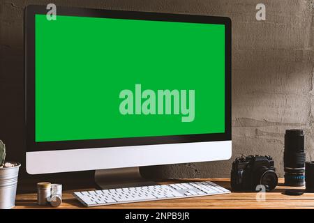 Computer Angled View Chroma key green screen, angled view computer on table with a book ...