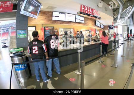 ATLANTA, GA - OCTOBER 25: Fans line up for concessions prior to the week 7  NFL game between the Atlanta Falcons and the Detroit Lions on October 25,  2020 at Mercedes-Benz Stadium