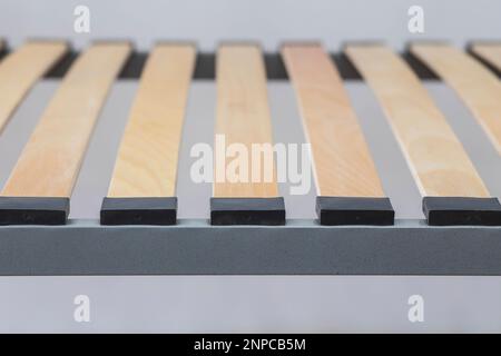 Wooden slats on a metal bed frame close-up Stock Photo