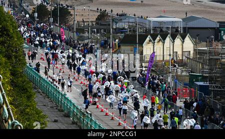 Brighton UK 26th February 2023 - Thousands of runners wearing foil blankets after taking part in the 33rd Brighton Half Marathon on a bright morning along the South Coast . Over ten thousand runners are expected to take part helping to raise money for various charities: Credit Simon Dack / Alamy Live News Stock Photo