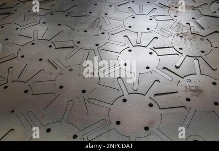 Steel sheet in which parts are laser cut Stock Photo