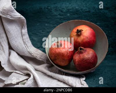 Still Life with fresh Pomegranate Fruits in bowl Stock Photo