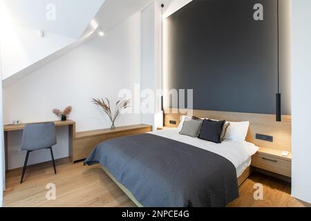 Beautiful Furnished Master Bedroom Interior Design in Luxury Home. Big Modern Bedroom. Stock Photo