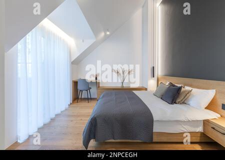 Beautiful Furnished Master Bedroom Interior Design in Luxury Home. Big Modern Bedroom. Stock Photo