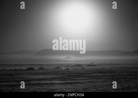 Sunrise over a Bedouin Settlement in Wadi Rum Desert in Jordan in Monochrome Black and White Stock Photo
