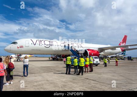 Passengers leaving Virgin Atlantic Airbus A350-1000 aircraft, Grantley Adams International Airport, Christ Church, Barbados, Caribbean Stock Photo