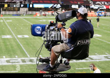 A FOX Sports television camera operator works from a mobile elevated  position during the first half of an NFL football game between the  Jacksonville Jaguars and the Atlanta Falcons, Sunday, Nov. 28, 2021, in  Jacksonville, Fla. (AP Photo/Phelan M