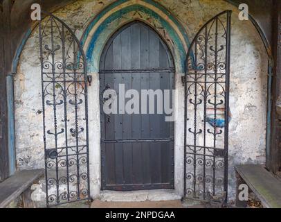 Britains Ecclesiastical Heritage  - North Porchway gated entrance to St Marys Church, Runwell in Essex, Britiain. Stock Photo