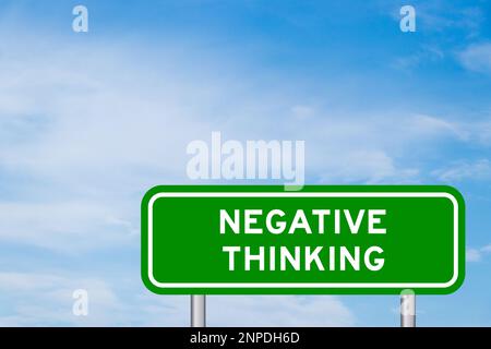 Green color transportation sign with word negative thinking on blue sky with white cloud background Stock Photo
