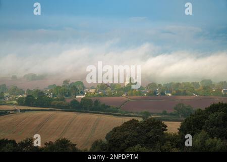 Morning mist over the village of Trellech in Wales. Stock Photo