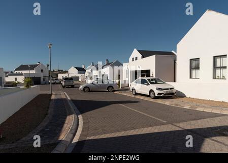 Langebaan, West Coast, South Africa. 2023. New build homes and vehicles parked in the street in Langebaan. Stock Photo