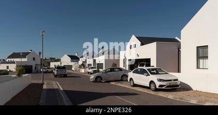 Langebaan, West Coast, South Africa. 2023. New build homes and vehicles parked in the street in Langebaan. Stock Photo