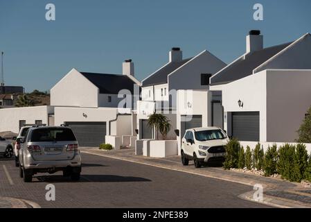 Langebaan, West Coast, South Africa. 2023. New build homes and vehicles parked in the street in Langebaan. Stock Photo