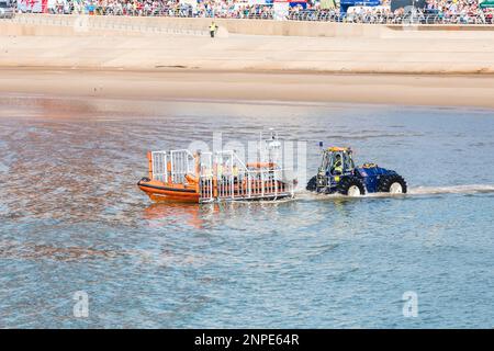 Life boat being launched from its semi submersible tractor off Blackpool beach. Stock Photo