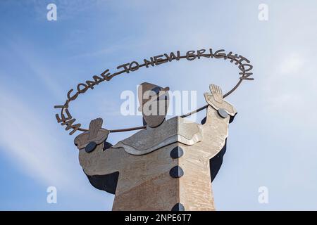 Looking up at the Welcome to New Brighton statue seen marking the entrance to the seaside town on the Wirral. Stock Photo