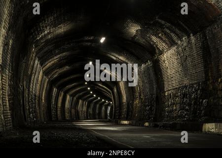 A view inside the empty disused Cressbrook Tunnel on the Monsal Trail. Stock Photo