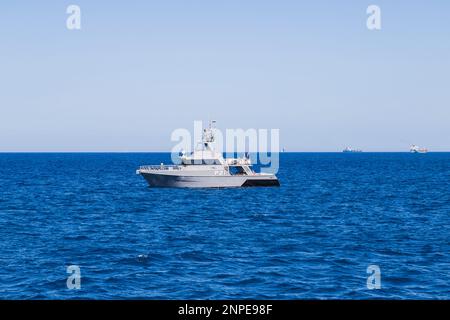 Armed Forces of Malta patrolling the sea off the coast of Bugibba. Stock Photo