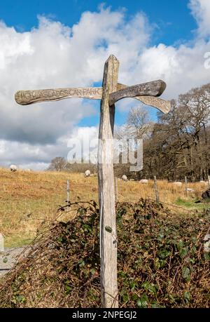 Close up of wooden public footpath sign to Aira Force near Ullswater in spring. Stock Photo