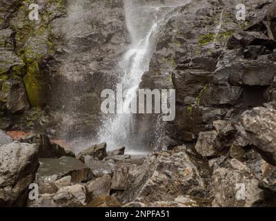 Close up for waterfall Fossa (Fossá) during strong wind in rainy weather, Streymoy Island, Faroe Islands, Denmark - Gasadalur Mulafossur Waterfall Stock Photo