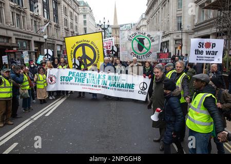 London, UK. 25th February, 2023. Demonstrators march through central London to call for a ceasefire and negotiated settlement in Ukraine a year after Russia's invasion. The march and rally were organised by Stop the War Coalition (StWC) and the Campaign for Nuclear Disarmament (CND). Credit: Mark Kerrison/Alamy Live News Stock Photo